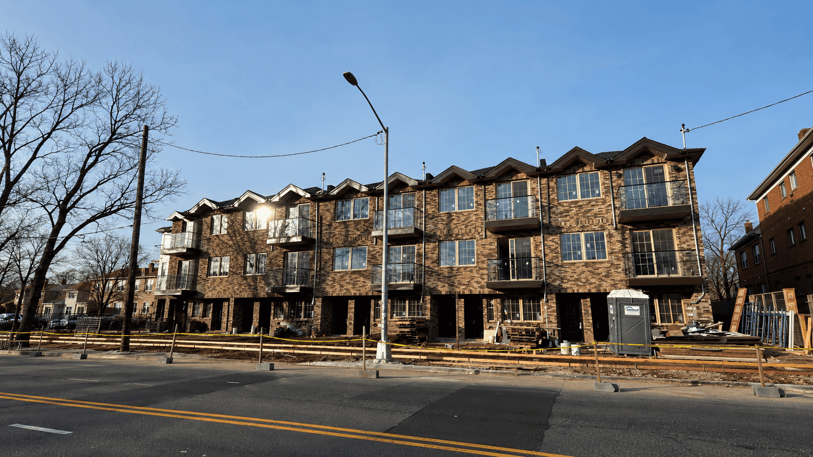 Five attached three-family residences in Queens, New York.